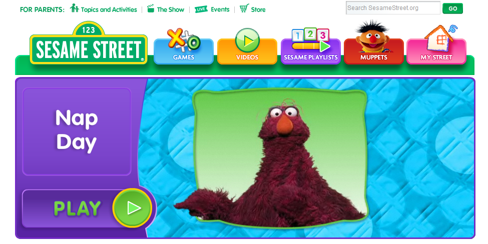 Sur sesame street une mascotte indique où cliquer Sur sesame street une mascotte indique où cliquer